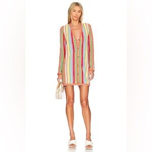 Alexis Tucker knit mini dress in rainbow stripes with raffia buttons